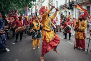 Colorful street parade featuring traditional dance and music in lively celebration.